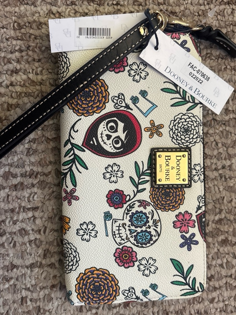 Dooney & Bourke Cream Floral Sugar Skull Wristlet with Black Strap